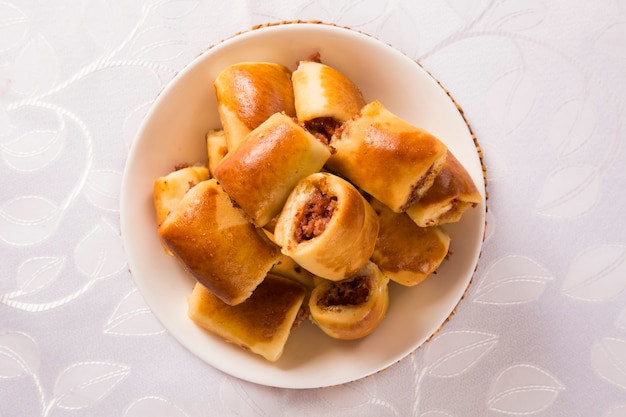 Brazilian snack. Pepperoni snacks portion on the table.