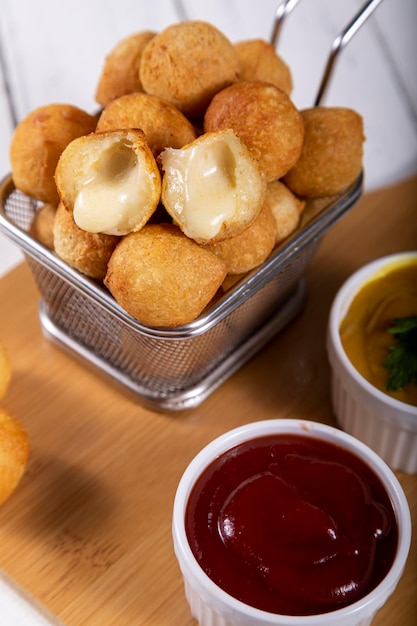 Brazilian snacks fried balls stuffed with cheese