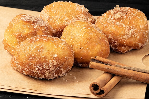 Brazilian sweet known as bolinho de chuva covered with cinnamon.