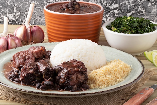 Brazilian traditional food feijoada on plate