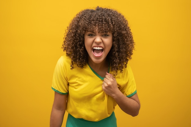 Brazilian woman fan celebrating on soccer