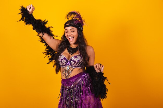 Brazilian woman wearing carnival clothes dancing partying