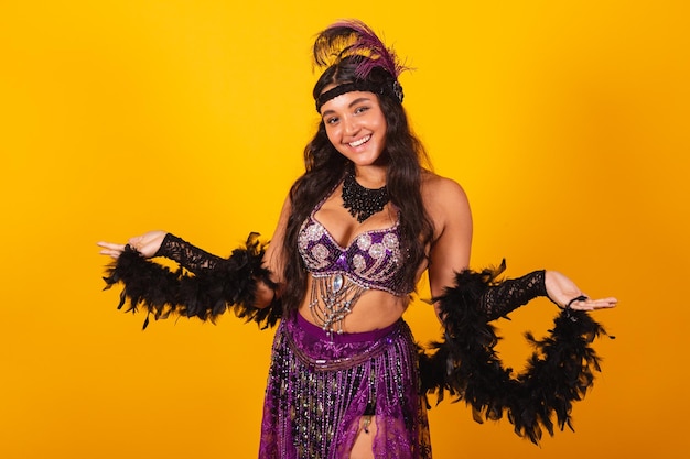 Brazilian woman wearing carnival clothes with open arms welcome