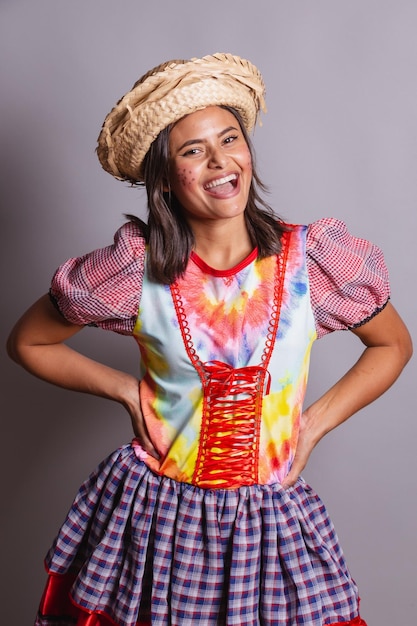 Brazilian woman wearing country clothes Sao Joao party Junina party photo poses