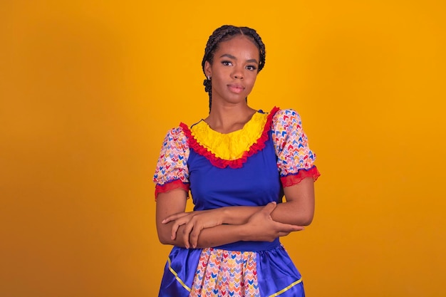 Brazilian woman wearing typical clothes for the Festa Junina with cross arms