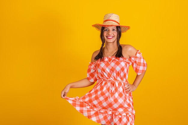 Brazilian woman wearing typical clothes for the Festa JuninaxA