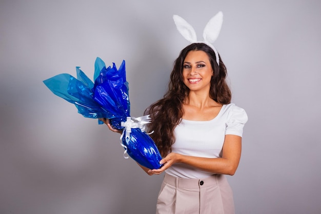 Brazilian woman with bunny ears and easter egg