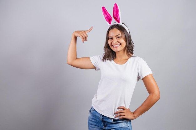 Brazilian woman with bunny ears Easter smiling happily wow