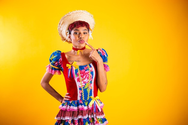 Brazilian woman with festa junina clothes arraial feast of saint john kiss showing lips