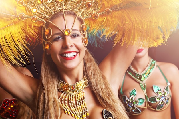 Brazilian women dancing samba music at carnival party