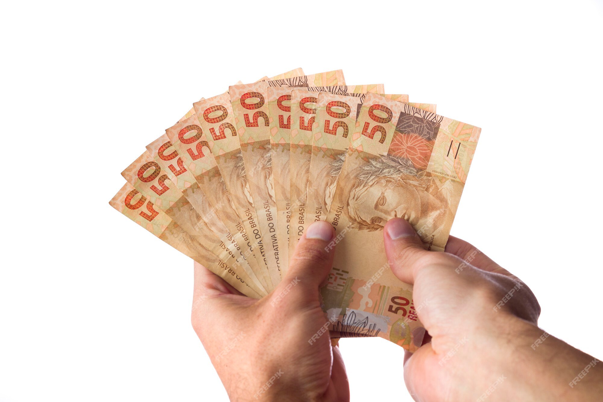 Premium Photo  Brazillian money, man holding 50 reais notes