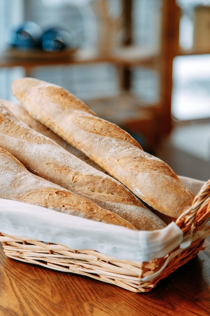 Bread assortment of french baguette and rye bread. bread basket\
close-up.