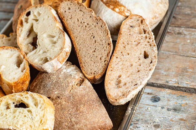 bread assortment of pastrie many different kinds of bake ciabata rye wheat and more