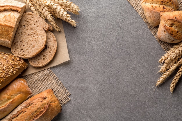 Bread background with wheat, aromatic crispbread with grains, copy space