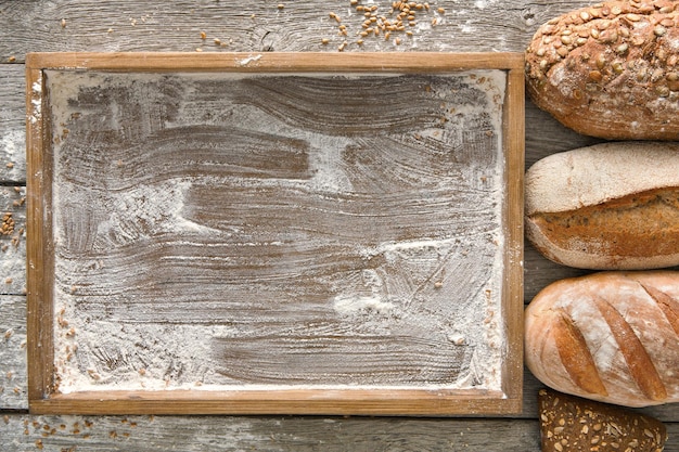 Bread bakery background. Brown and white wheat grain loaves comp