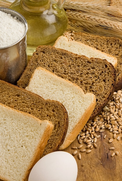 Bread and bakery products on wooden board