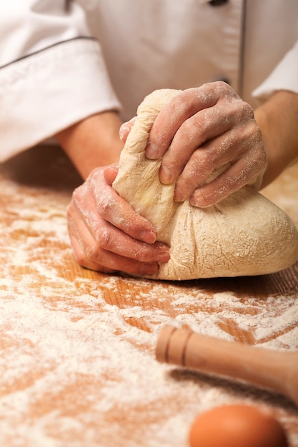 Bread baking, baker making dough