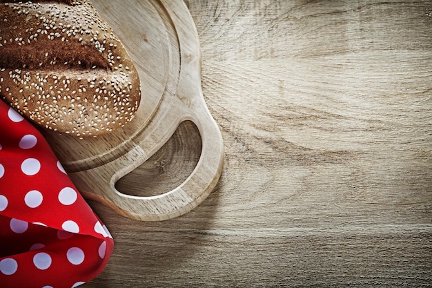 Bread chopping board tablecloth on wooden background