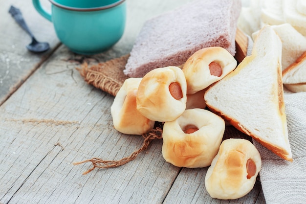 bread and coffee on table.