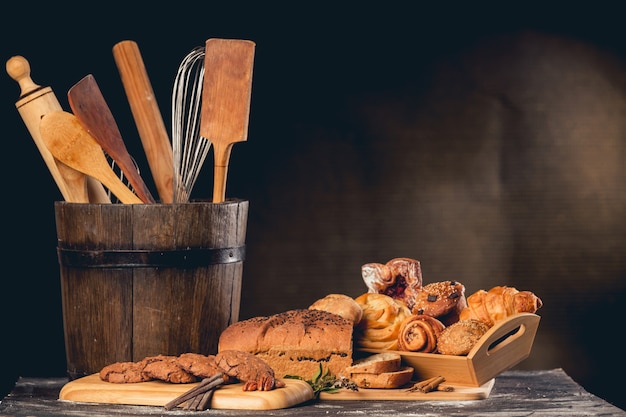 Bread and cookies with chocolates on a concrete table