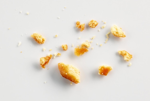 Bread crumbs on white background