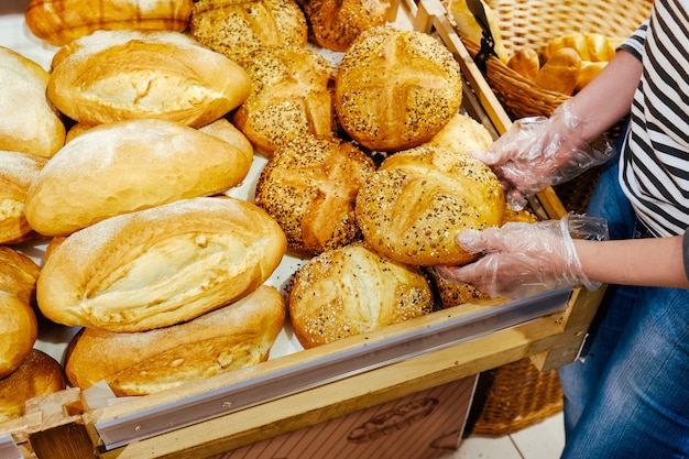 Bread femle hand food background brown graine baguette roll pastries batch product baked