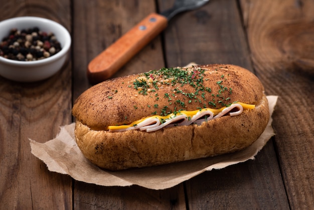 Bread ham cheese on wood