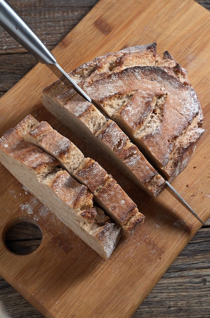 Bread and knife on cutting board