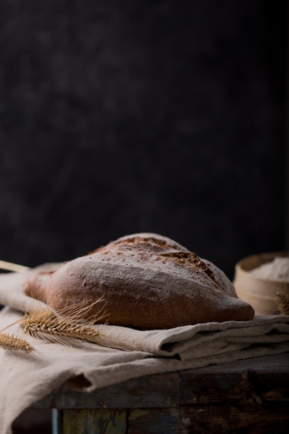 Bread Loaf Sliced On Wooden Table. 