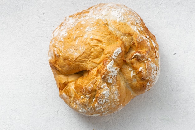 Bread loaf on a white  top view