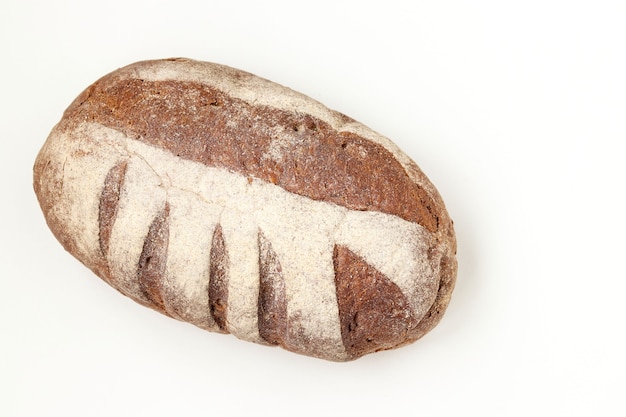 Bread made from whole grain flour located on a white