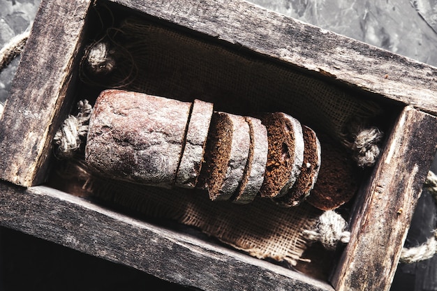 Photo bread in an old wooden box already cut into pieces. food