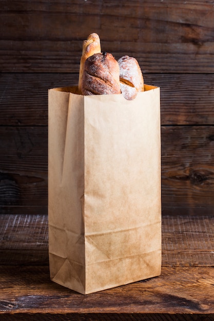 Bread rolls tucked into a paper bag