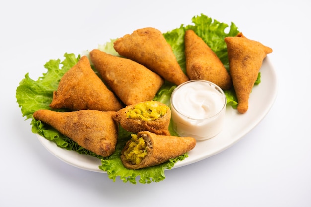 Bread samosa is a variation of regular samosa with same potato peas filling using sandwich bread slices for the outer covering