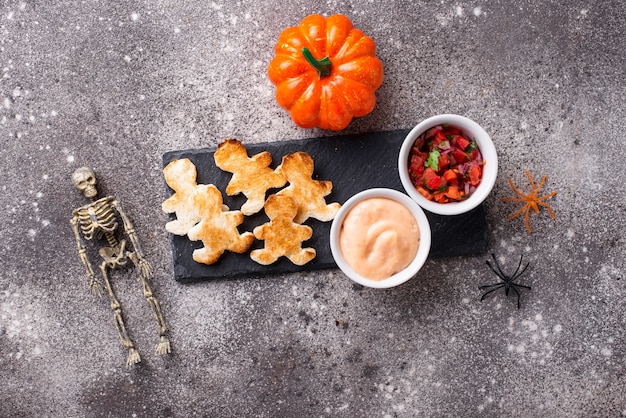 Bread in shape of men and sauces