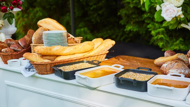 Bread and stack of plates for group catering.