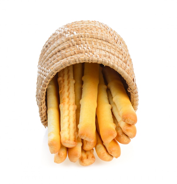 Bread sticks in basket isolated on white 