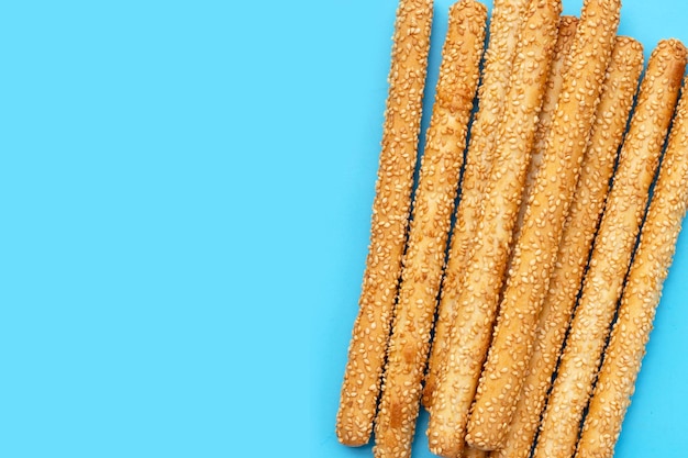 Bread sticks on blue background