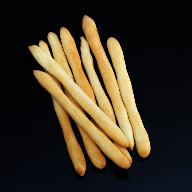 Bread sticks on dark ,