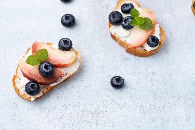bread toast with peach and blue berry