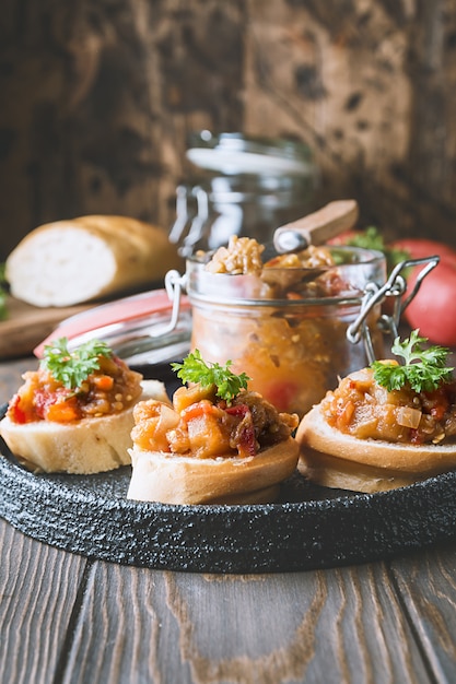 Bread toasts with eggplant caviar.