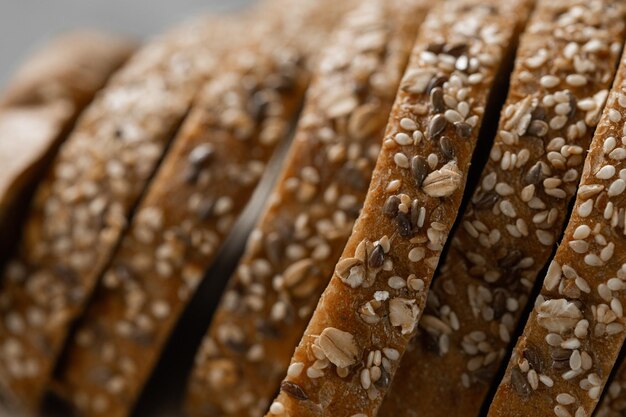 Bread traditional sourdough bread cut into slices on a rustic wooden background