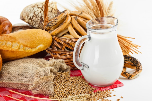 Bread and wheat grains on a white background