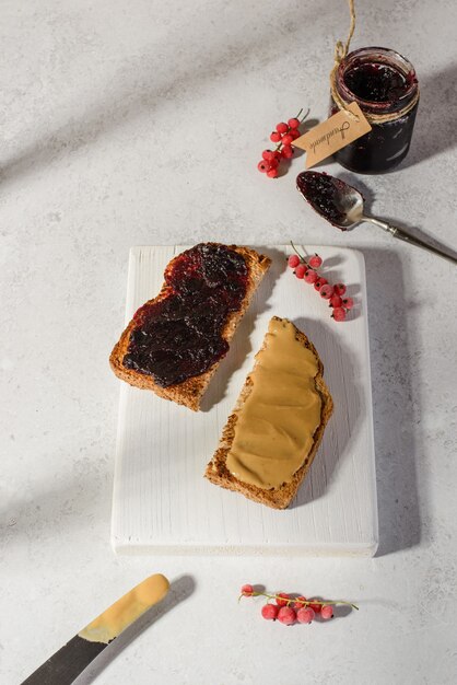 Bread with berry jam and peanut paste