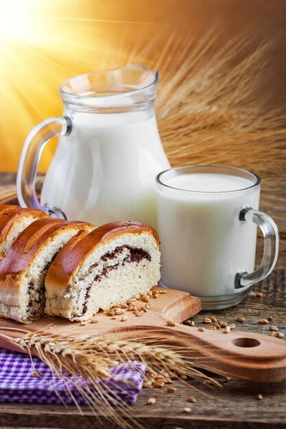 Bread with cocoa and milk in jar and glass