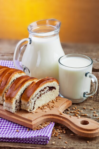 Bread with cocoa and milk in jar and glass