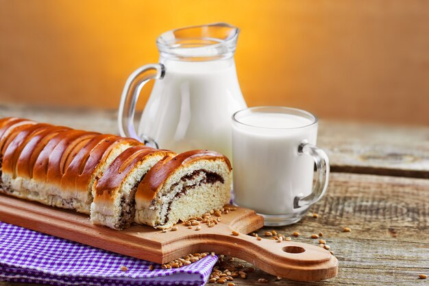 Bread with cocoa and milk in jar and glass