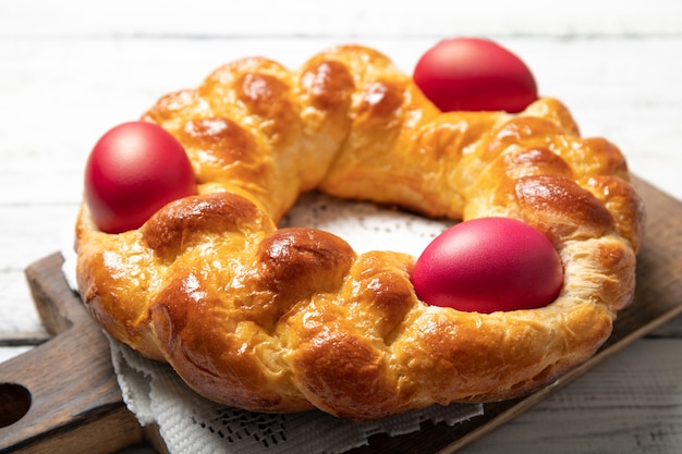 Bread with easter eggs on a wooden board