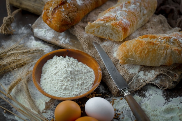 Bread with kitchen accessories on the table