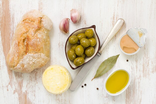 Bread with olives, fish pate and olive oil